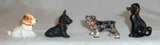 4 Old Painted Cast Iron Miniature Dogs Paperweights or Toys with One Advertising