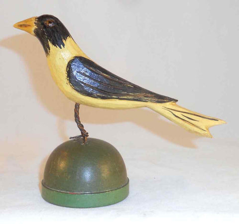 2008 Hand Carved Polychrome Painted Wooden Primitive Folk Art Yellow and Black Colored Bird Wire Legs Green Base By Jonathan Bastian