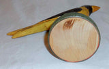 2008 Hand Carved Polychrome Painted Wooden Primitive Folk Art Yellow and Black Colored Bird Wire Legs Green Base By Jonathan Bastian