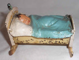 Vintage Iron & Tin Polychrome Painted Penny Bank Baby in Cradle with Bird