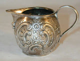 1760s French Silver Miniature Creamer Repousse Floral Design